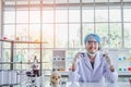 A successful male chemist is examining his new innovation in a laboratory. Royalty Free Stock Photo