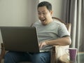 Successful Man Celebrating Victory, Entrepreneur Working Online Business From Home