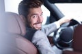 Successful man sitting behind the wheel of a prestigious car Royalty Free Stock Photo