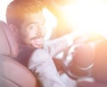 Successful man sitting behind the wheel of a prestigious car Royalty Free Stock Photo