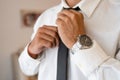 Successful man with white shirt ties necktie