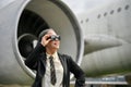 A successful mature Asian businesswoman is at the airport, going on her business trip Royalty Free Stock Photo