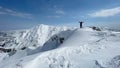 Successful mountaineer`s solo summit hike and stunning winter views