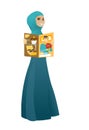 Successful muslim business woman reading magazine.