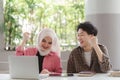 A successful Muslim girl university student and her friends are seen raising their hands in celebration after checking Royalty Free Stock Photo