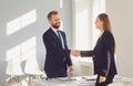 Successful office interview. The conclusion of the contract. Businessman and businesswoman handshake at the table after Royalty Free Stock Photo