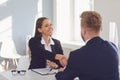 Successful office interview. The conclusion of the contract. Businessman and businesswoman handshake at the table after Royalty Free Stock Photo