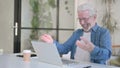 Successful Senior Old Man Celebrating on Laptop in Office Royalty Free Stock Photo