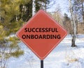 Successful onboarding symbol. Concept words Successful onboarding on beautiful red road sign. Beautiful forest snow blue sky Royalty Free Stock Photo