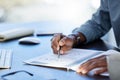 The successful person is the average man. an unrecognizazble businessman doing paperwork in an office at work. Royalty Free Stock Photo