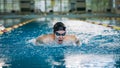 Female swimmer swimming butterfly stroke in the pool Royalty Free Stock Photo