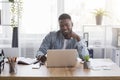 Successful project. Smiling businessman looking at laptop screen at workplace. Royalty Free Stock Photo