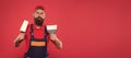 Successful renovation. Repair success. Bearded man worker with plastering tools. Plasterer hipster builder in cap red Royalty Free Stock Photo