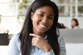 Successful sales manager african woman sitting at workplace closeup portrait