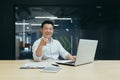 Successful seller asian businessman happy and smiling looking at camera pointing finger forward man in office working Royalty Free Stock Photo