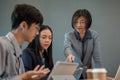 A successful senior female CEO is in the meeting with her team, coaching and briefing a new project Royalty Free Stock Photo