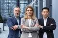 Successful and serious diverse team of three business people, focused looking at camera Royalty Free Stock Photo