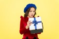 Successful shopping. small girl hold holiday gift. happy birthday. boxing day. parisian girl in french beret go shopping