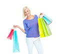 Successful shopping spree. An excited young woman holding shopping bags while isolated on a white background. Royalty Free Stock Photo