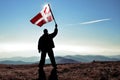 Successful silhouette man winner waving Denish flag on top of the mountain Royalty Free Stock Photo