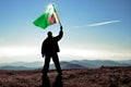 silhouette man winner waving Zambia flag on top of the mountain peak Royalty Free Stock Photo