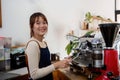 Successful small business owner young asian woman barista stand at her cafe Royalty Free Stock Photo