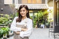 Successful small business young asian owner woman standing with looking at camera posing crossing arms Royalty Free Stock Photo