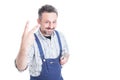 Successful smiling mechanic showing victory sign or number two Royalty Free Stock Photo