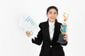 Successful smiling young Asian business woman celebrating with trophy award over white isolated background. Success achievement in Royalty Free Stock Photo