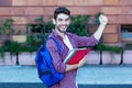 Successful spanish male student cheering about graduation Royalty Free Stock Photo