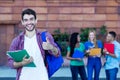 Successful spanish male student with group of students Royalty Free Stock Photo