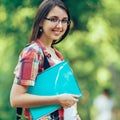 Successful student with books in the Park on a Sunny day Royalty Free Stock Photo