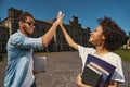 Successful students greeting each other after the exam Royalty Free Stock Photo