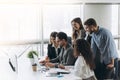 Successful team. Group of young business people working and communicating together in creative office Royalty Free Stock Photo