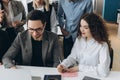 Successful team. Group of young business people working and communicating together in creative office Royalty Free Stock Photo