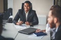 Team leader and business owner leading informal in-house business meeting Royalty Free Stock Photo