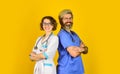 Successful team of medical doctors. People in uniforms yellow background. Medical staff. trust our professionals