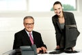 Successful team of senior man and young woman Royalty Free Stock Photo