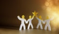 Successful Teamwork Concepts. Paper Cut as Group of Worker Raise Up a Star Together. Business Strategy. Working to Committed and