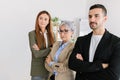 Successful three business people with crossed arms standing together at office Royalty Free Stock Photo