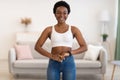 Happy African Lady Wearing Skinny Jeans After Slimming At Home