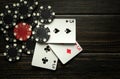 Successful win with three aces playing cards. Poker game with three of kind or set combination on vintage black table