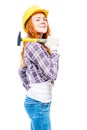 successful woman with a hammer in a yellow hard hat against Royalty Free Stock Photo