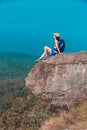 Woman hiker enjoy the view on cliff edge top of mountain Royalty Free Stock Photo