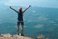 Woman hiker enjoy the view on cliff edge top of mountain Royalty Free Stock Photo