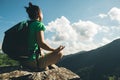 woman hiker meditation on mountain top cliff edge Royalty Free Stock Photo