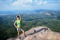 Woman hiker taking picture with smartphone Royalty Free Stock Photo