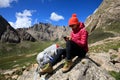Woman hiker use smartphone in mountain top rock Royalty Free Stock Photo