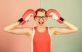 Successful womanhood. Woman boxing gloves adjust eyeglasses. Strength and intellect balance. Know how defend myself Royalty Free Stock Photo