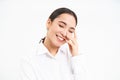 Successful women. Happy laughing asian woman smiling, looks carefree, stands over white studio background Royalty Free Stock Photo